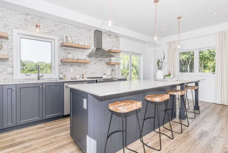Modern custom kitchen with black cabinetry, white quartz island, wood barstools, and open shelving by Cerwood Custom Cabinetry.